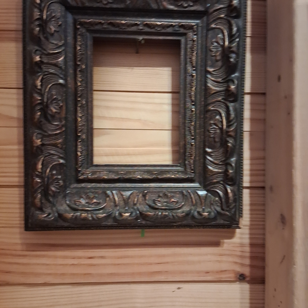 Ornate Brown Photo Frame. Holds 5×7 Photo. Frame Measures 11 1/2" W × 13 1/2" L.